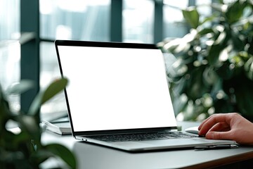 Laptop with blank screen, indoor setting, plants