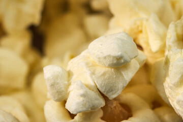 Fluffy white popcorn pieces fill a bowl, invitingly arranged for a movie night or snack time at home