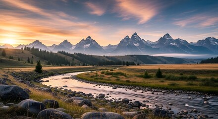 Majestic sunset over the grand teton mountains with river and rocky foreground