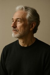 Obraz premium Thoughtful elderly caucasian male in black sweater with gray hair and beard