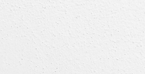 White concrete wall texture background. Uneven render stucco white painted concrete wall texture background. Rough and grunge wall in the sun.