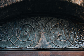 Ornate Wrought Iron Transom with Textured Glass