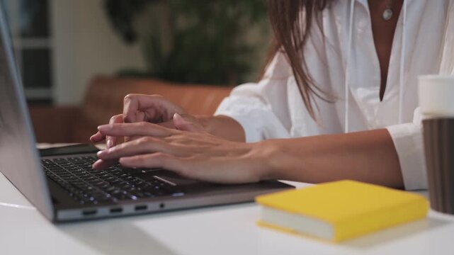 Hands, typing and laptop or online connection as freelance journalist for web information, project planning or research. Person, fingers and work from home or internet email, editing or technology