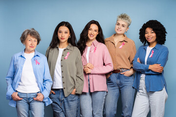 Obraz premium Interracial women showing pink ribbons for breast cancer awareness