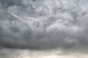 Dramatic sky with layered gray rain clouds, showcasing natural cloud textures and moody atmosphere, perfect for backgrounds and weather-related design.