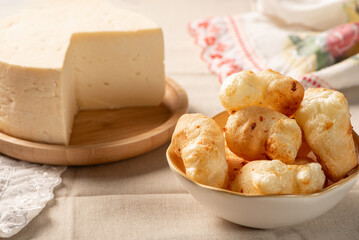 Cheese bread, table with cheese bread and semi-cured cheese from Brazil, selective focus.