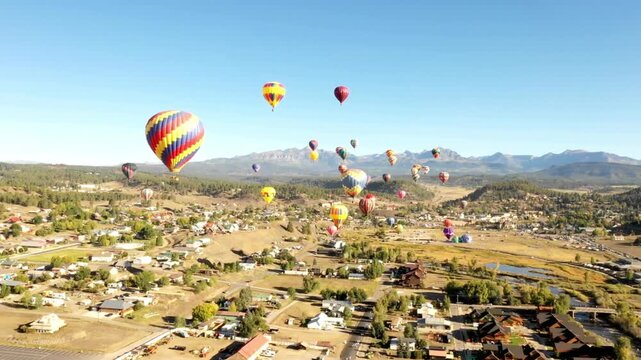 Hot air balloons floating over pagosa springs during a balloon festival