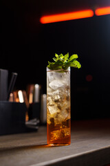 Double layer drink with ice in a bar in a glass