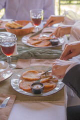 A festive table on a sunny day with lots of snacks