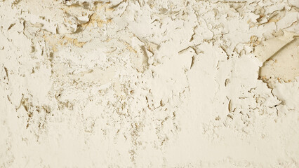 Wall surface with peeling, cracked, and damaged paint due to moisture and water damage