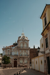 Historic pastel blue building with ornate details in the old town of Algarve, Portugal.