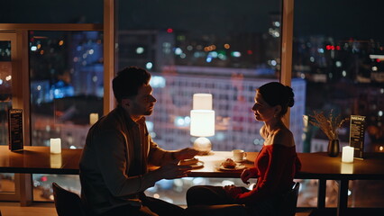 Loving people talking restaurant with night city view closeup. Bonding couple