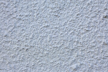 White or grey cement wall background. Close up.