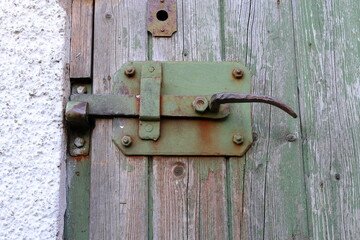 Old style lock on aged door.