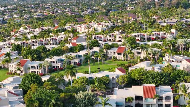 Aerial view of luxry condo vacation homes along beach in Wailea, Hawaii on Maui tropical island landscape - 4K Drone