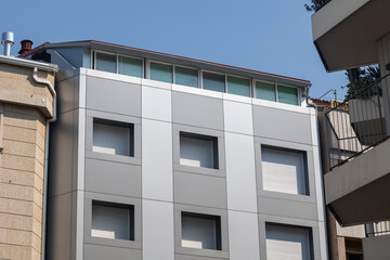 Modern building with metal cladding and skylights showcasing contemporary architecture