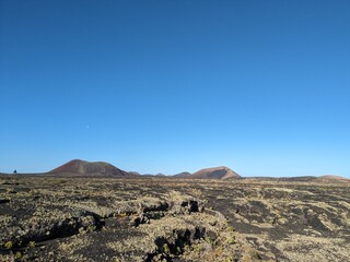 Volcanic mountain landscape panorama on Lanzarote, Canary Islands, showing dramatic terrain and arid natural beauty Spain