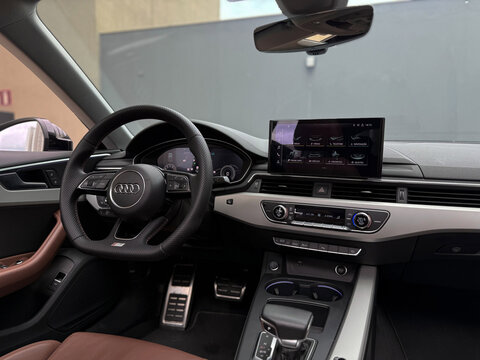 Dashboard and cockpit of a modern Audi S5 with digital screens, High-tech interior of a luxury german car.

