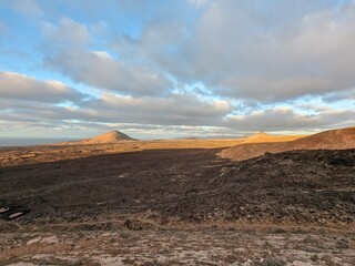 Volcanic mountain landscape panorama on Lanzarote, Canary Islands, showing dramatic terrain and arid natural beauty Spain