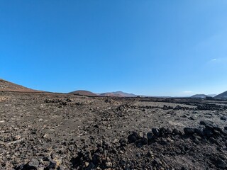 Volcanic mountain landscape panorama on Lanzarote, Canary Islands, showing dramatic terrain and arid natural beauty Spain