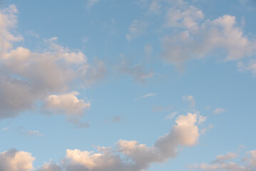 Blue sky with white clouds as a background.