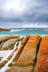 orange rocks and the sea