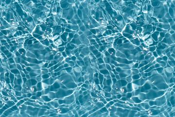 Blue water with ripples on the surface. Defocus blurred transparent blue colored clear calm water...