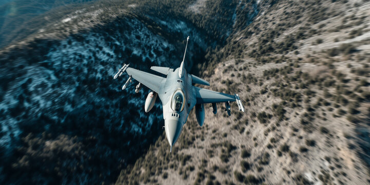 F16 Fighting Falcon flying with high altitude over the mountains