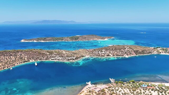 4k drone video of Garip and Kalem islands with turquoise sea and coral reefs in Bademli. Dikili, a district of Izmir famous for its turquoise sea in Turkiye.