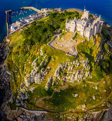 Aerial view of St Michael&rsquo;s Mount island with harbor, boats, and castle