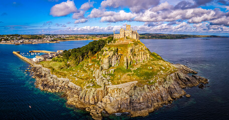 Aerial view of St Michael&rsquo;s Mount island with harbor, boats, and castle