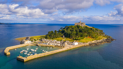 Aerial view of St Michael&rsquo;s Mount island with harbor, boats, and castle