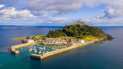 Aerial view of St Michael&rsquo;s Mount island with harbor, boats, and castle