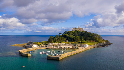 Aerial view of St Michael&rsquo;s Mount island with harbor, boats, and castle