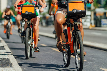 Several cyclists pass through a bike path in the Copacabana neighborhood (Rio de Janeiro, Brazil)