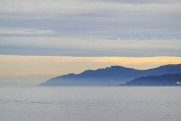 Obraz premium Coast Mountains and inlet in overcast light