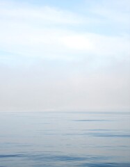 Calm, hazy ocean and sky