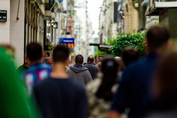 Crowd of people walk down Florida Street during Buenos Aires rush hour