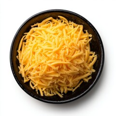 A close-up shot of shredded cheddar cheese in a bowl. The cheese is bright yellow in color and has a shredded texture