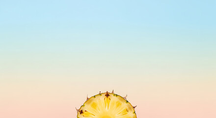 A vibrant slice of fresh pineapple against a soft pastel gradient background.