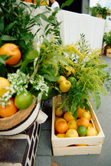 Wooden crate of citrus fruits with green foliage