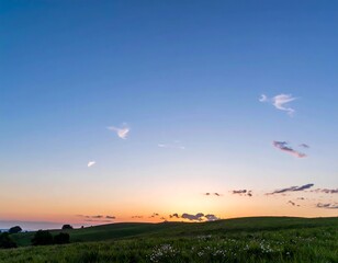 Sunset over grassy fields