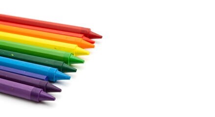 A Vibrant Collection of Colorful Crayons Arranged in a Rainbow Color Spectrum on White Background