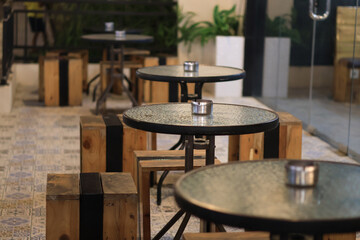 Empty table and chair in coffee shop cafe and restaurant, Empty modern cafe interior with wooden tables and warm cozy light setting.