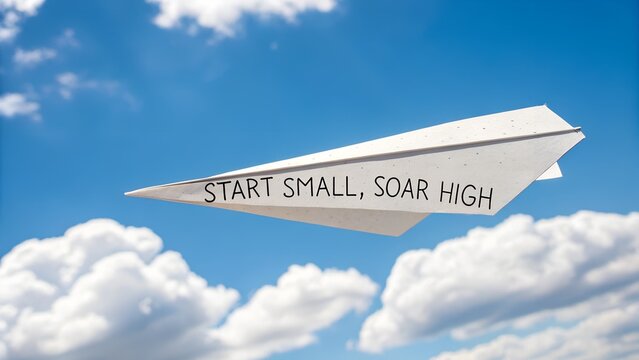 Paper airplane with motivational quote flying in blue sky clouds - Powered by Adobe