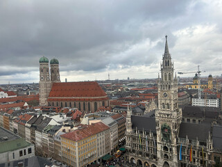 Fototapeta premium Historic Skyline of Munich Old Town Beneath a Cloudy Sky