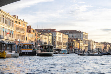 Blur Views of grand canal with boats, gondolas, mansions along. Venice, Italy.