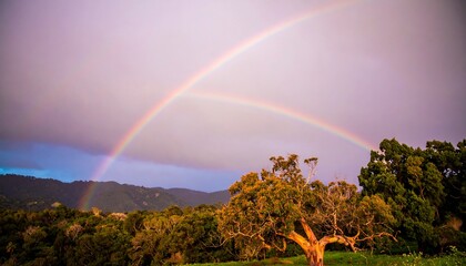 Double rainbow over hills
