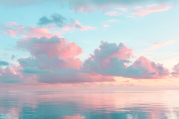 Naklejka premium Pastel-toned sunrise over a calm sea, with soft clouds