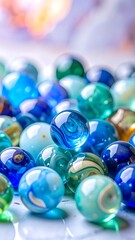 Close-up of various translucent blue, green, and white marbles